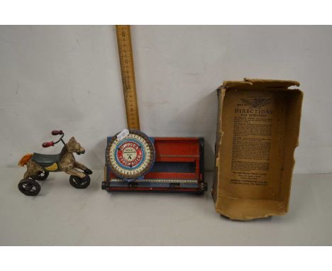 A child's Simplex typewriter together with a toy wheeled horse