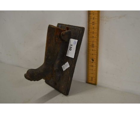 An iron boot shaped door knocker