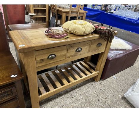 A modern light oak kitchen side table, 118cm wide