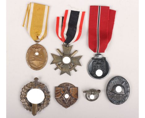 Grouping of German Third Reich medals and decorations. Including the SA sport badge in tombac, Westwall medal, Eastern front 