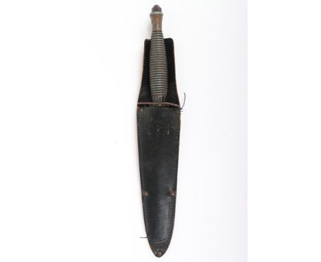 British 3rd Pattern Fairbairn Sykes (F.S) Commando Knife, with one piece ribbed grip having top nut. Ferrule with crossed key