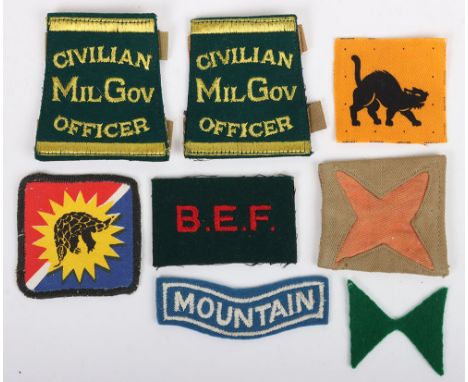 Small collection of British Army cloth badges. Lot includes examples of a printed 9th Corps Formation badge. A WW2 example of