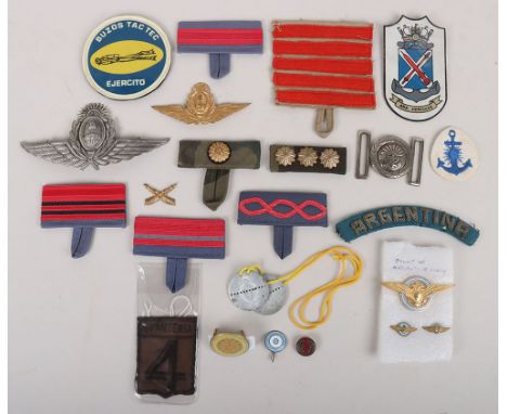 Argentine Military Badges: A good selection of cloth and metal badges to include camouflage rank , normal rank, silver wire A