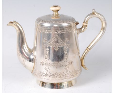 A late 19th century Russian silver bachelors coffee pot, of conical form with engraved decoration, having ivory finial and in