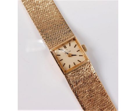 A lady's 9ct Omega wristwatch, the square dial, 14mm wide, with baton numerals, manual wind movement, slightly tapered textur