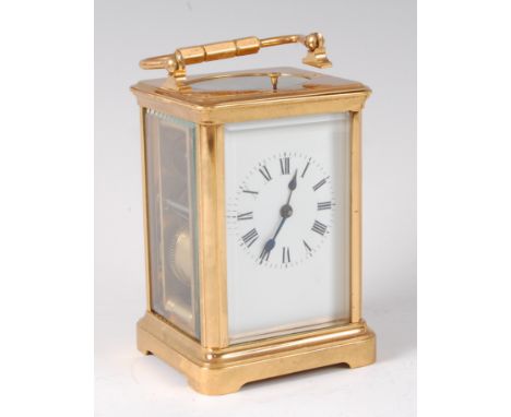 A circa 1900 French lacquered brass cased carriage clock, having unsigned white enamel dial, visible platform escapement, hou