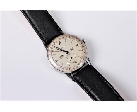 A gentleman's mid 20th century Movado triple calendar wristwatch, the silvered dial with Arabic and baton numerals, outer min