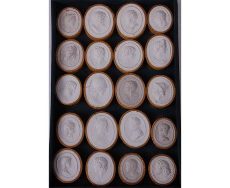 A collection of twenty Italian Grand Tour plaster intaglios, being profile portrait medallions, in box with fully hand-annota