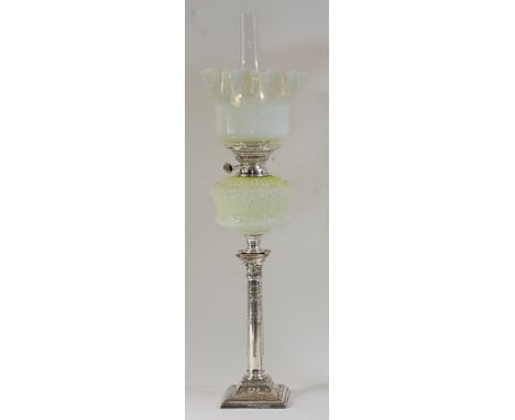 A late Victorian silver plated pedestal oil lamp, having vaseline glass shade over vaseline glass font, to a plated column em