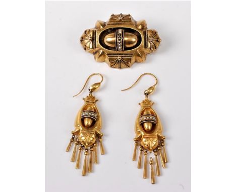 An Etruscan revival memorial brooch and earrings, the central oval dome decorated with a band of seed pearls with a thin blue