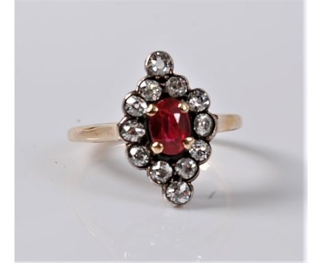 A synthetic ruby and diamond ring, the oval ruby, approx. 6.2 x 4.3mm, in a four claw mount, surrounded by old round brillian