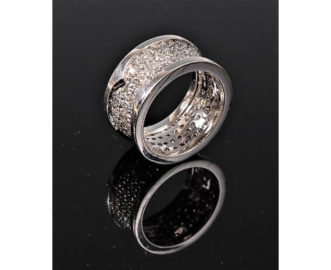 An 18ct wide full hoop eternity ring, the 1cm band pave set with small diamonds within an outer plain raised edge, total esti