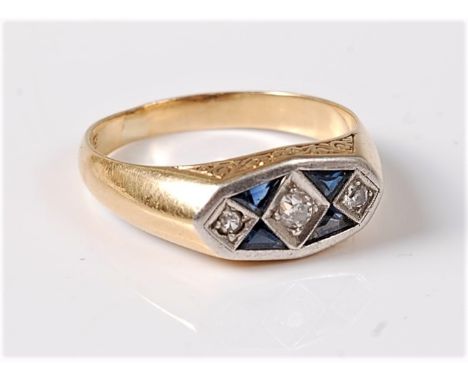 An 18ct Art Deco style ring, the three slightly graduated diamonds interspersed with triangular cut sapphires, all set in whi