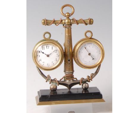 An early 20th century brass and silvered metal marine clock/barometer, modelled as an anchor supporting clock dial on left ha