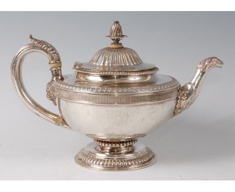 A Victorian silver pedestal teapot, of squat circular form, having a finial topped cover, leaf capped handle, and engraved co