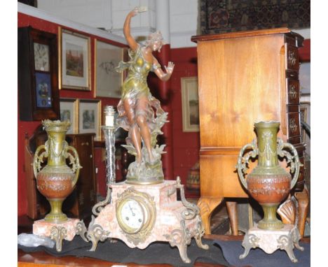 A French late 19th century spelter and rouge marble three piece clock garniture, surmounted with a classical figure; a glass 