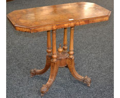 A Victorian walnut occasional table, crossbanded and quarter veneered canted rectangular top, four turned columns, underfinia