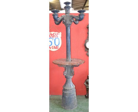 A decorative five light garden lamp post.