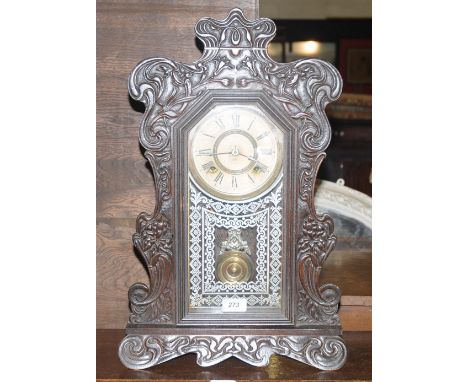 An Art Nouveau American gingerbread clock by Ansonia.