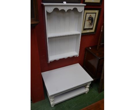 A white painted coffee table and white painted wall shelf 