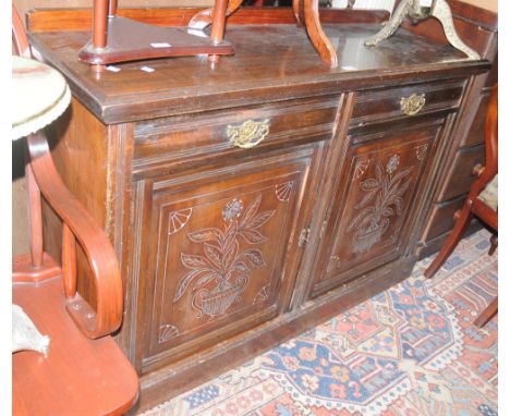 An art Nouveau mahogany sideboard, galleried back, two drawers over two carved panel back door cupboard plinth bases 