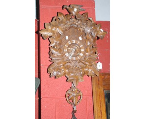 A Black Forest style cuckoo clock.   Condition Report:  Images available57cm without pendulum, 75cm approx from top to bottom