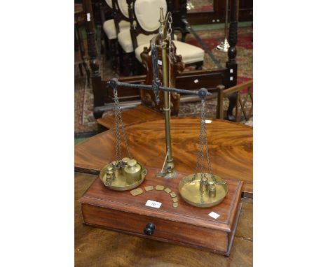 A set of brass and mahogany scales, C. Stevens and Sons, and brass weights