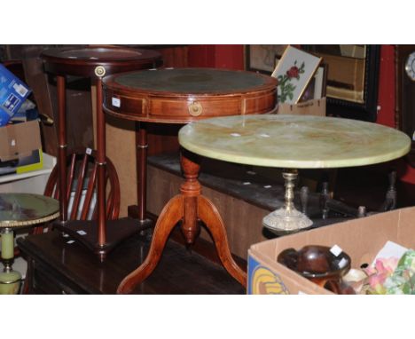 A reproduction drum table; two faux onyx pedestal tables; a novelty occasional table with inlaid clock (4) 