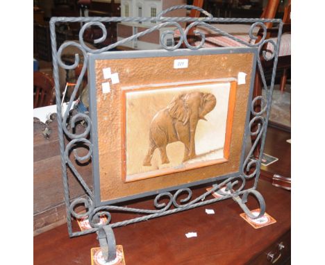 A copper and wrought iron firescreen.