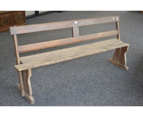 An oak tram bench style church pew. 186cm long.