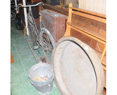 A vintage bicycle; two galvanized buckets; beaten copper firescreen; brass fender; iron taping dies; pig feeding iron basin; 
