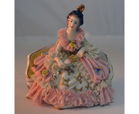 Glazed Porcelain Decorated, hand created, hand painted by the Artists of Dresden. Featuring a Lady in Lace attire Sitting on 