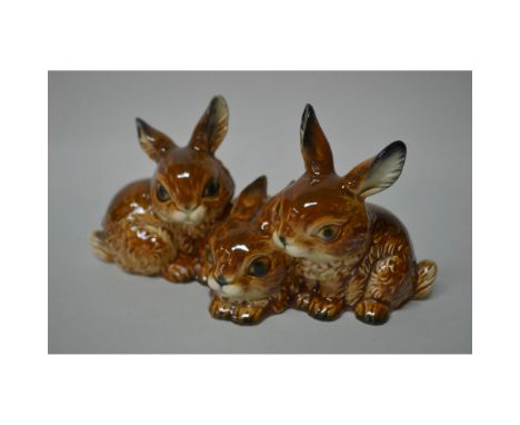 Glazed, Porcelain Decorated Sculpture, featuring Three Rabbits, sitting in a row, handmade, handpainted issued by Goebel. Iss