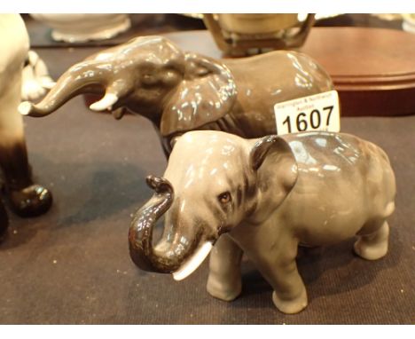 Beswick 974 trunk up elephant in dark grey and Royal Doulton HN 2664 elephant 