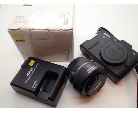 Nikon V1 digital camera body Nikon Nikkor 1 10-30mm 1:3.5 - 5.6 lens and accessories