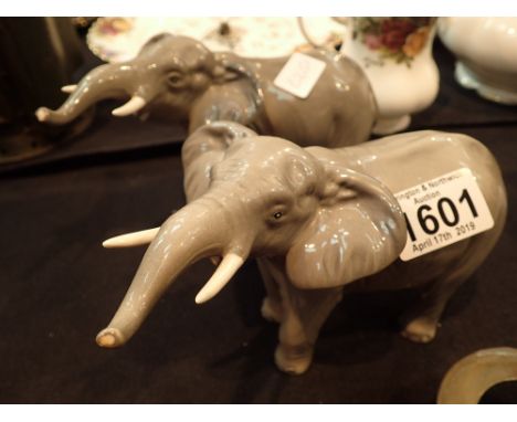 Two Beswick 974 trunk up elephants in light grey colourway 