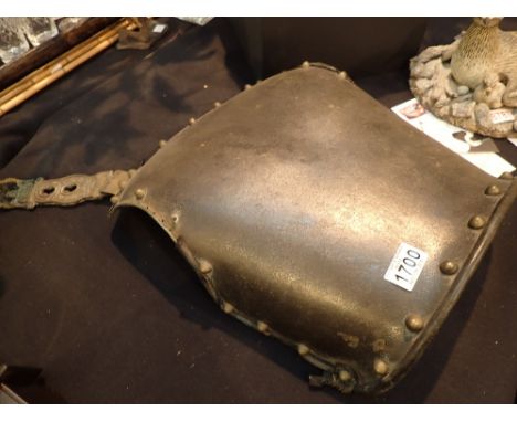Antique light gauge iron armour backplate with decorative brass strapping and brass studs H: 45 cm