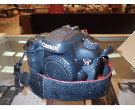 Canon EOS 7D mark II camera body only with accessories CONDITION REPORT: The lot comprises the camera body and three batterie
