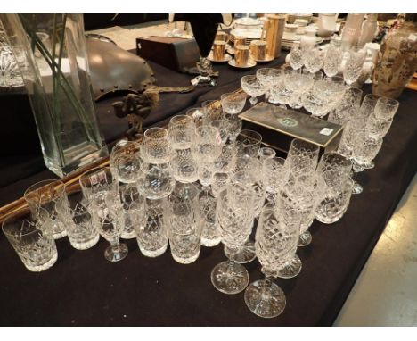 Large collection of crystal drinking glassware predominantly Waterford Crystal including whisky brandy and champagne saucers 