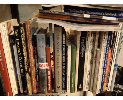 Shelf of photography books and magazines