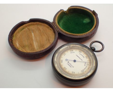 Handheld pocket barometer in leather case