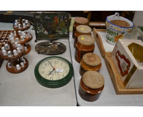 A set of five Hornsea storage jars; a cast iron book stand; a a teapot stand; and an wall clock 
