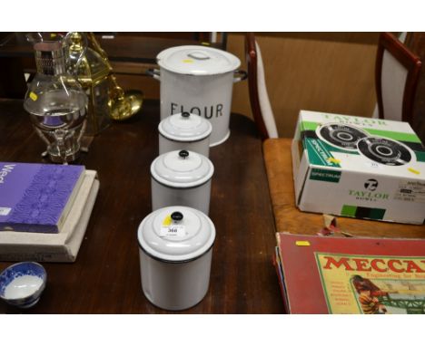 An enamel flour bin; together with three enamel storage jars 