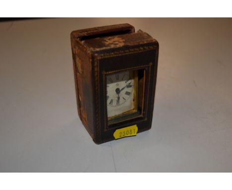 An Ansonia miniature carriage clock contained in leather case