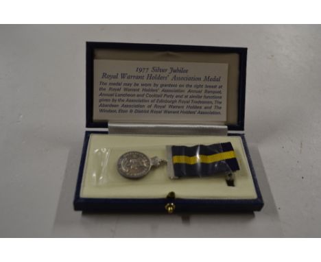 A 1997 Silver Jubilee Royal Warrant Holders Association medal to "John Bunton" in case