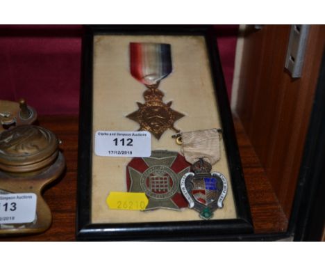 A First World War star; together with a medal, each contained in single frame; and a silver and enamel Masonic medal