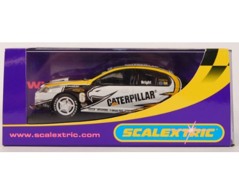 An original contemporary Scalextric 1/32 scale C2695 Ford Falcon BA "Caterpilla" no6 plastic slot car. Within its original pl