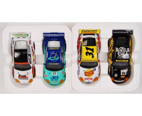 A collection of 2x original contemporary 1/32 scale Scalextric double packed racing slot cars. Within their original polystyr