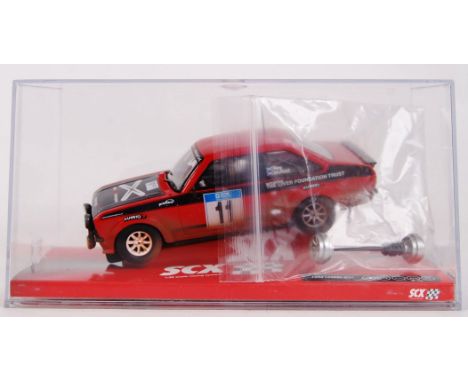 An original contemporary 1/32 scale SCX 64700 Ford Escort MKII "McRae" weathered dirt effect plastic racing slot car. Within 