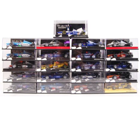 A large collection of 21x original 1/43 scale Minichamps diecast model F1 Formula One racing cars. Mint. All within their ori